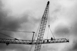 weekly toll Workers on a crane